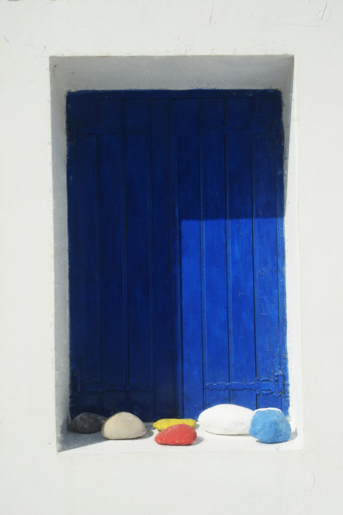 The Blue Door and Rocks of Milos Greece